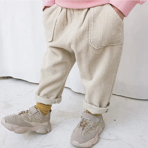 Beige children’s corduroy trousers with patch pockets