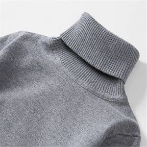 Close-up of the grey sweater roll-neck collar