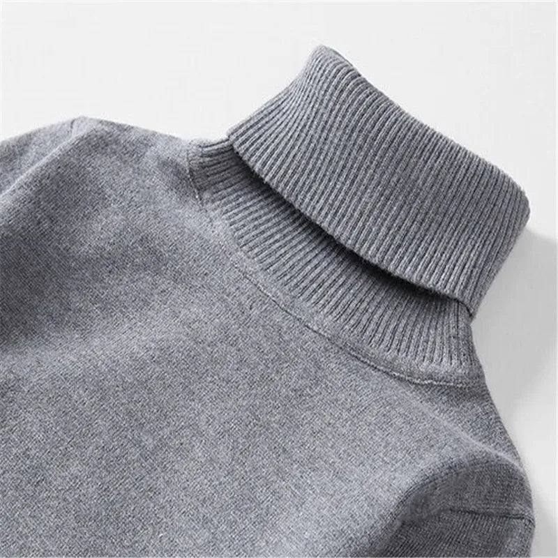 Close-up of the grey sweater roll-neck collar
